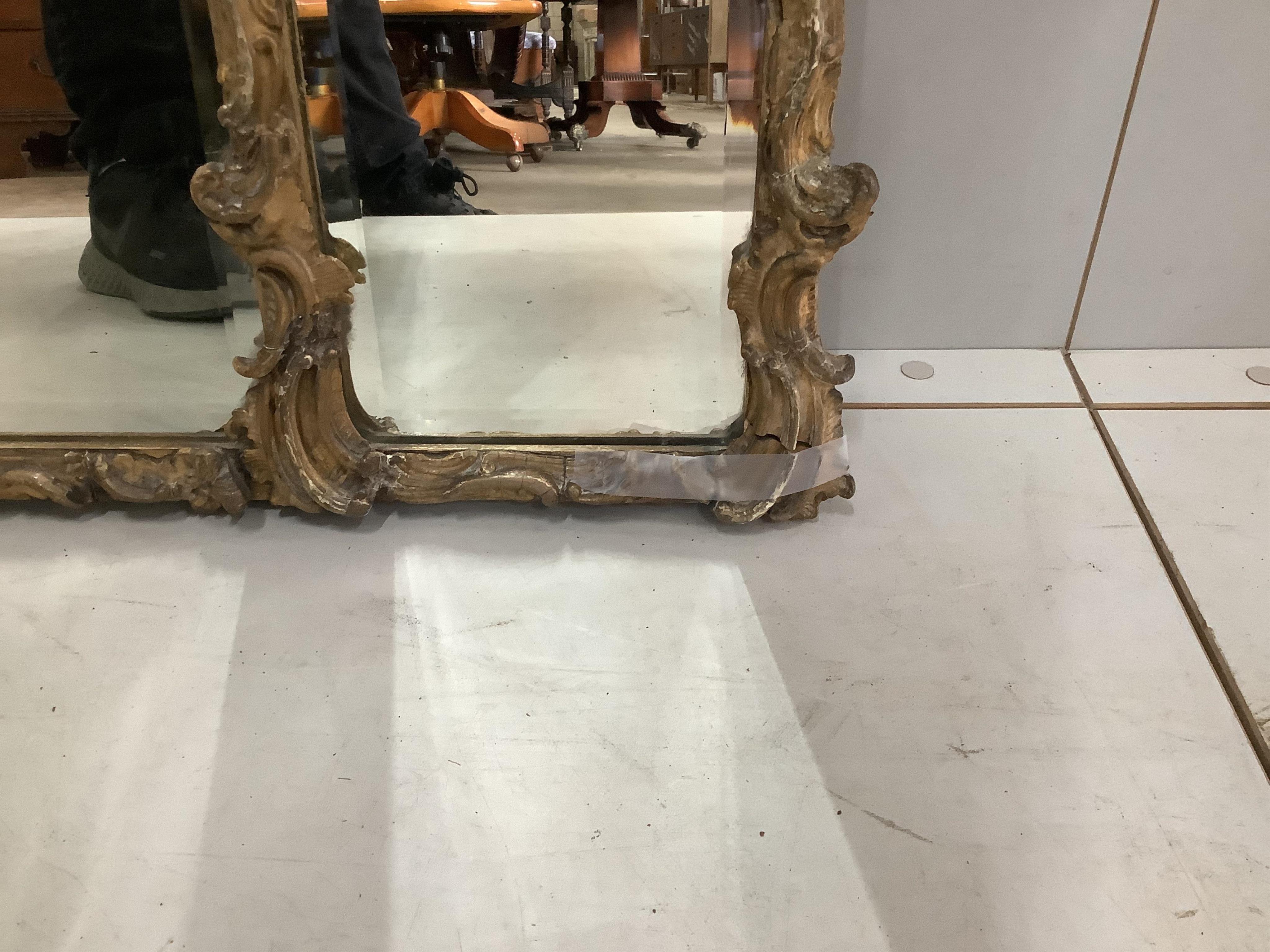 A late 19th century gilt and composition triple plate overmantel mirror, width 113cm, height 60cm. Condition - fair